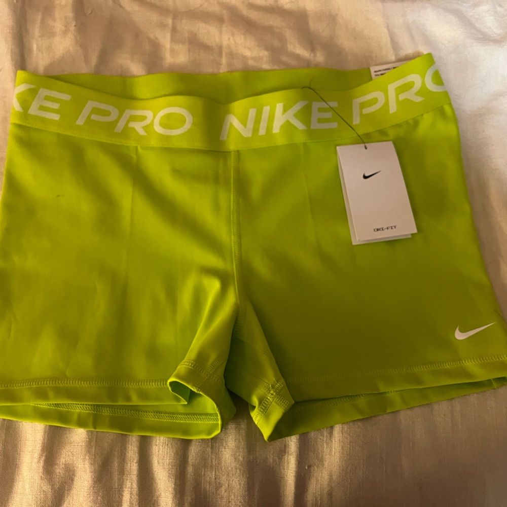 Brand new, never worn, XL Nike pro tight fit shorts in lime green